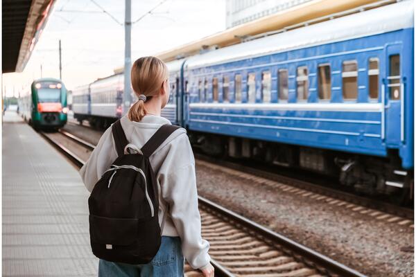 Women waits for the train at the Train station